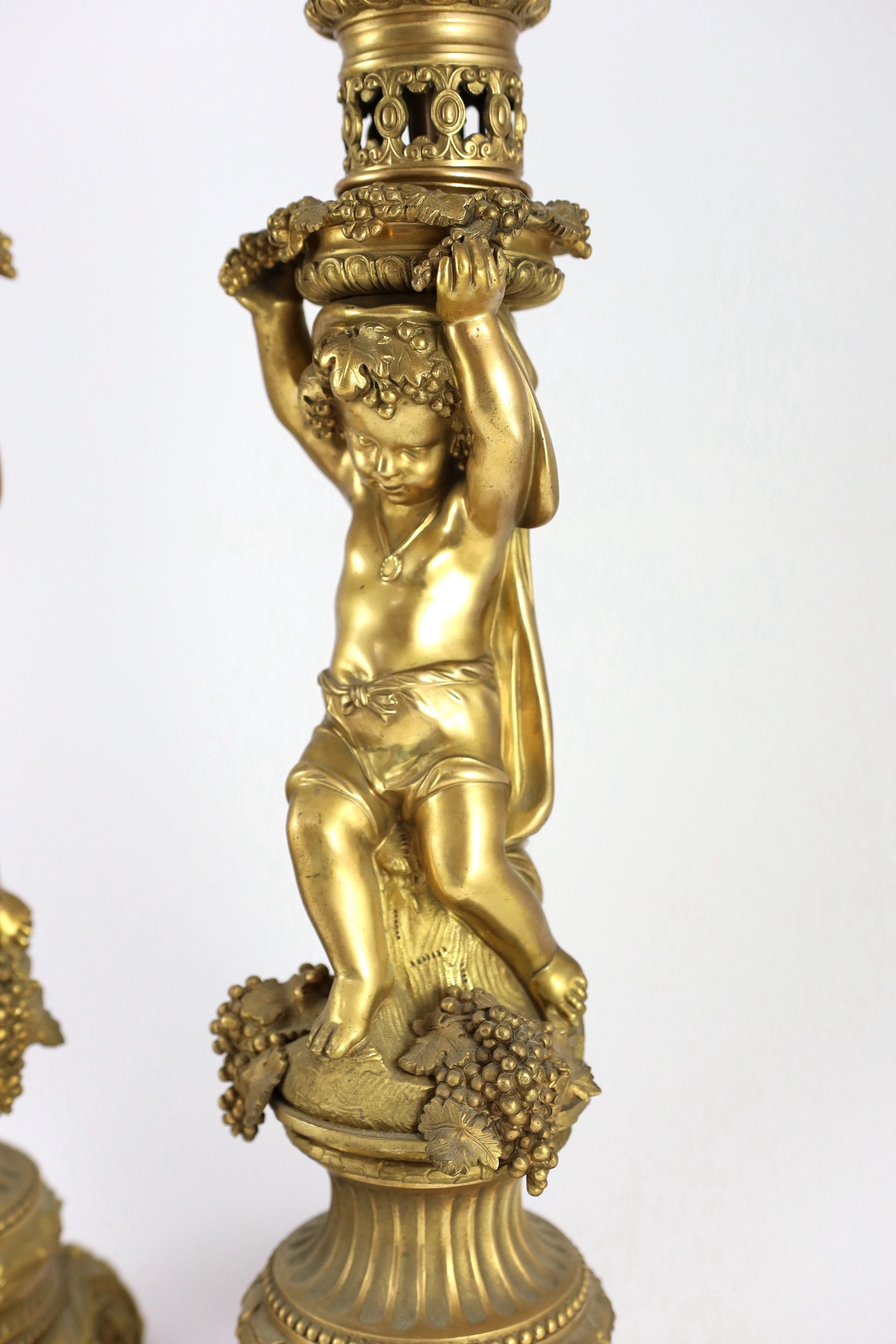A pair of Victorian style ormolu table lamps, 50cm high to fittings